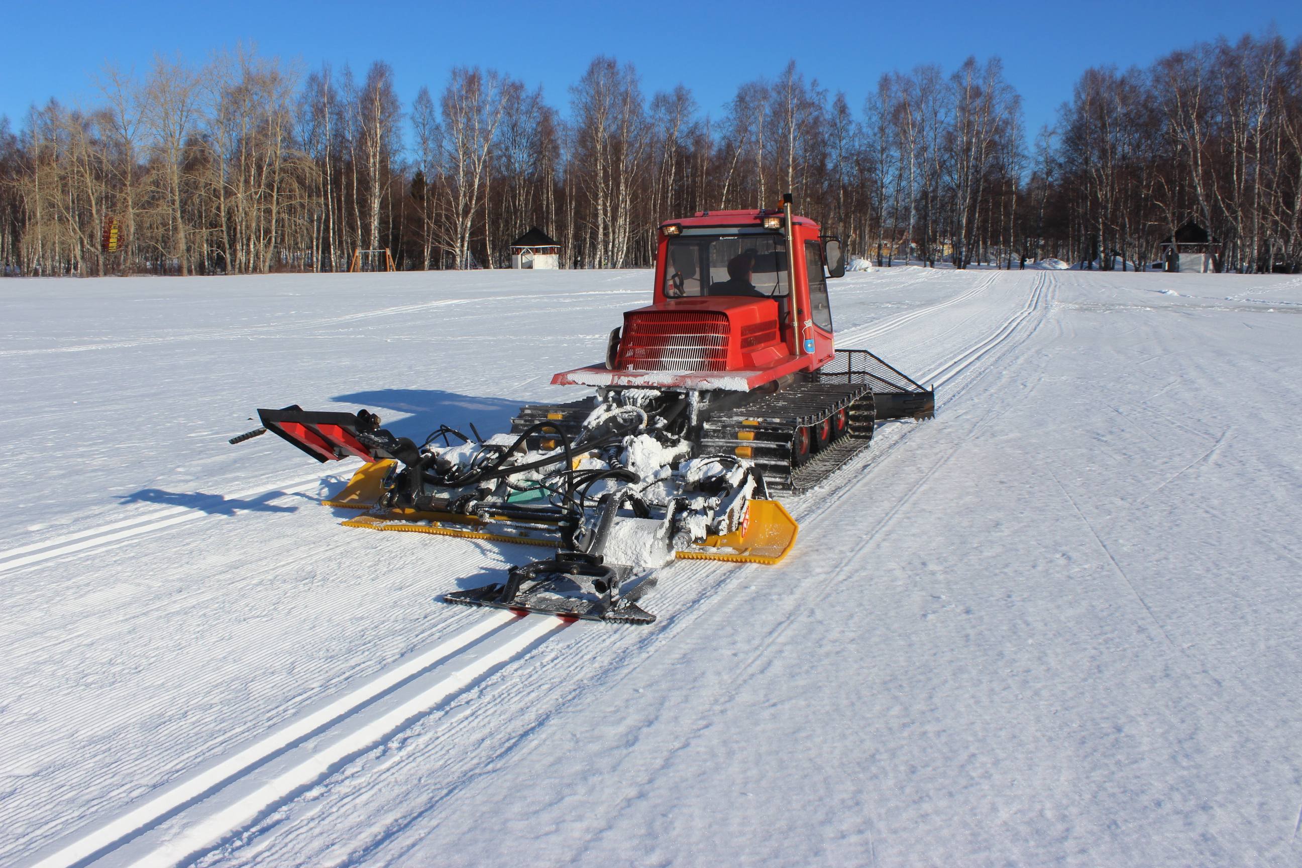 Ski track machine at work.
